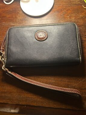 Dooney & Bourke Black Leather Zip Wallet with Brown Accents and Wrist Strap